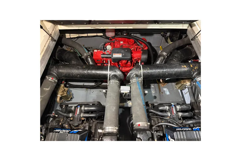 Slide: The Image of Engine compartment of a 2000 Sea Ray Sundancer 310 boat, showcasing mechanical components. - 58