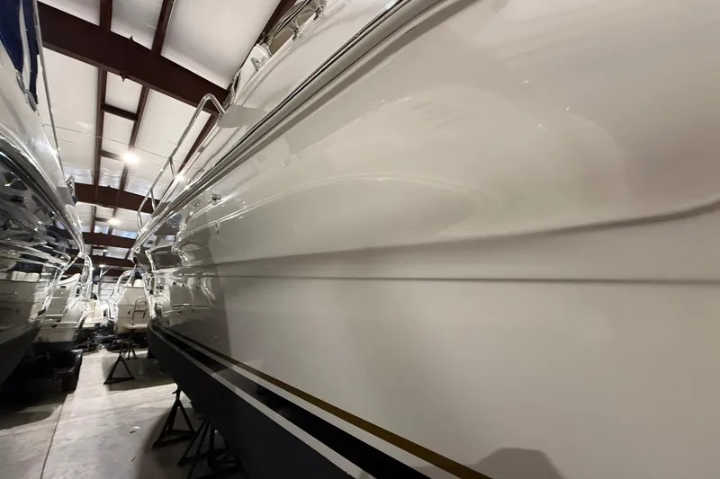 Slide: The Image of 2000 Sea Ray Sundancer 310 yacht in indoor storage, side view. - 65