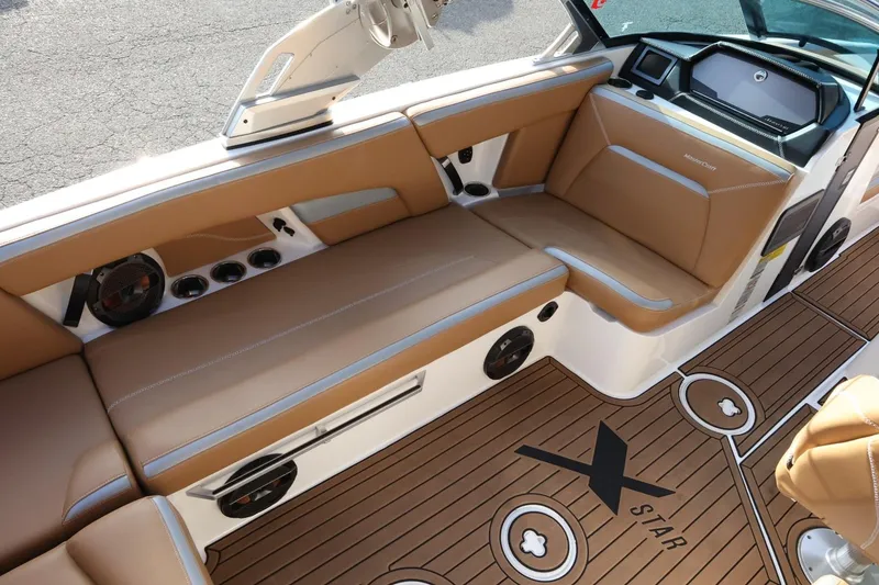 Slide: The Image of 2020 MasterCraft XStar interior with tan seating and sleek design. - 13