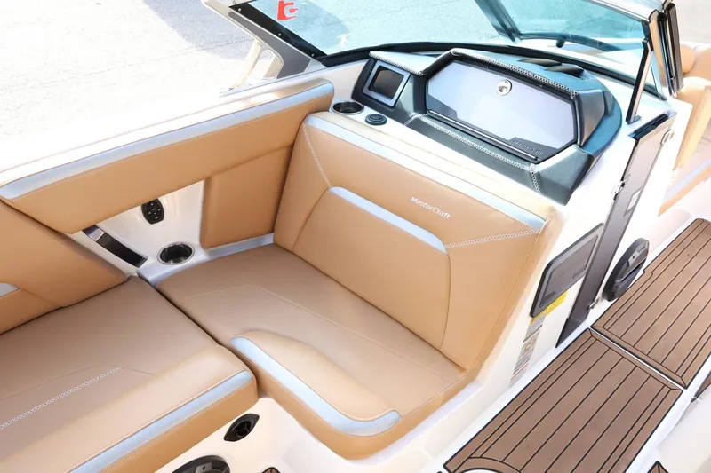 Slide: The Image of 2020 MasterCraft XStar interior with tan leather seats and modern dashboard design. - 15