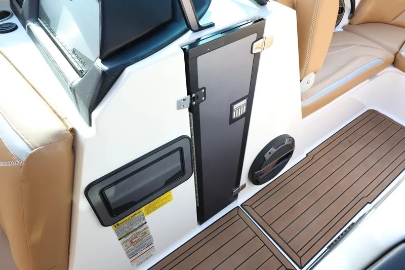 Slide: The Image of 2020 MasterCraft XStar interior with tan seating and sleek black accents. - 26