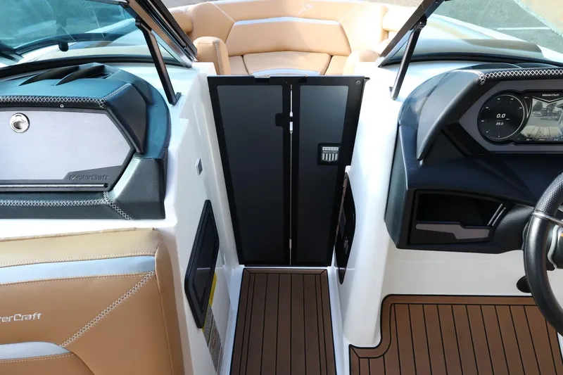 Slide: The Image of 2020 MasterCraft XStar boat interior with dashboard and seating details. - 27