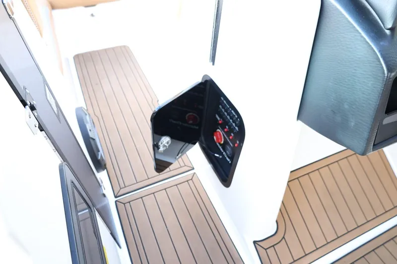 Slide: The Image of 2020 MasterCraft XStar interior with wood-style flooring and control panel. - 28
