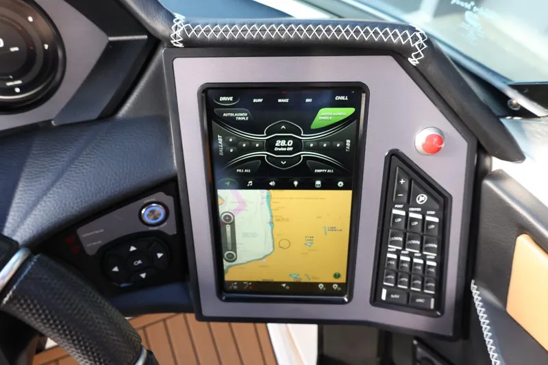 Slide: The Image of 2020 MasterCraft XStar dashboard with touchscreen controls and navigation display. - 31