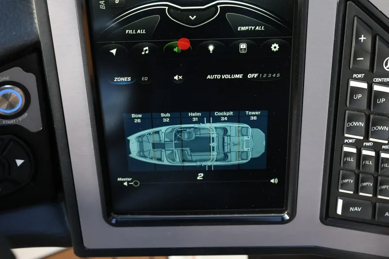 Slide: The Image of 2020 MasterCraft XStar dashboard display with audio and ballast controls. - 33
