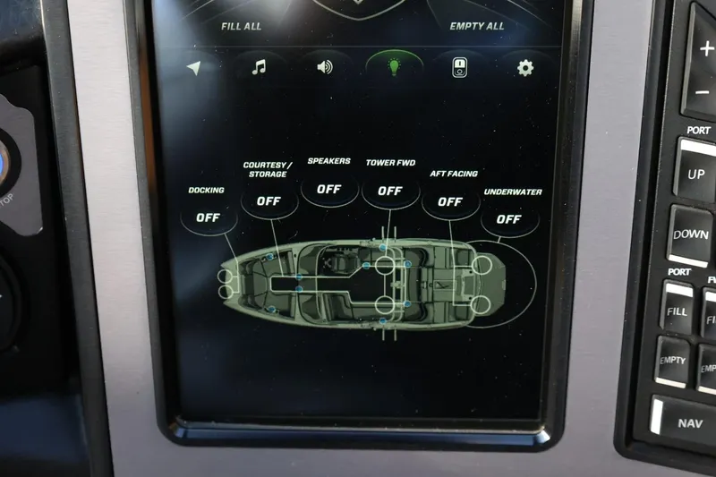 Slide: The Image of Touchscreen control panel of a 2020 MasterCraft XStar boat, showing lighting and speaker settings. - 34