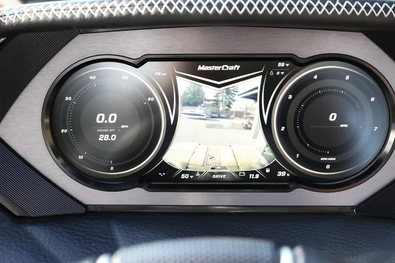 Slide: The Image of Dashboard of a 2020 MasterCraft XStar boat with digital display and controls. - 37