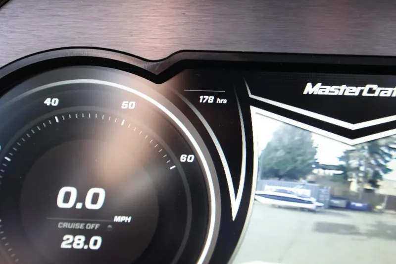 Slide: The Image of Dashboard of 2020 MasterCraft XStar showing 0.0 MPH and 178 hours. - 38