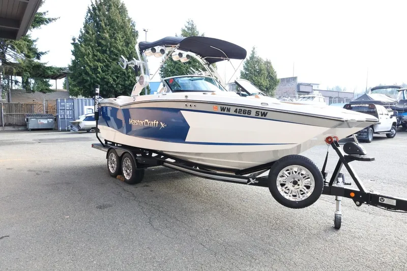 Slide: The Image of 2020 MasterCraft XStar boat on trailer in parking lot. - 4