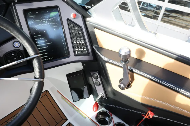Slide: The Image of 2020 MasterCraft XStar boat dashboard with touchscreen controls and steering wheel. - 40