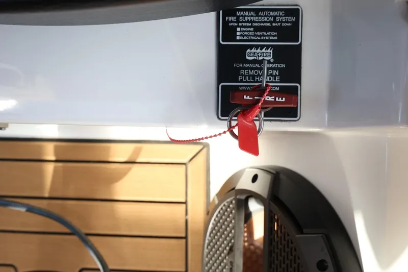 Slide: The Image of Fire suppression system on 2020 MasterCraft XStar boat with manual activation handle. - 42