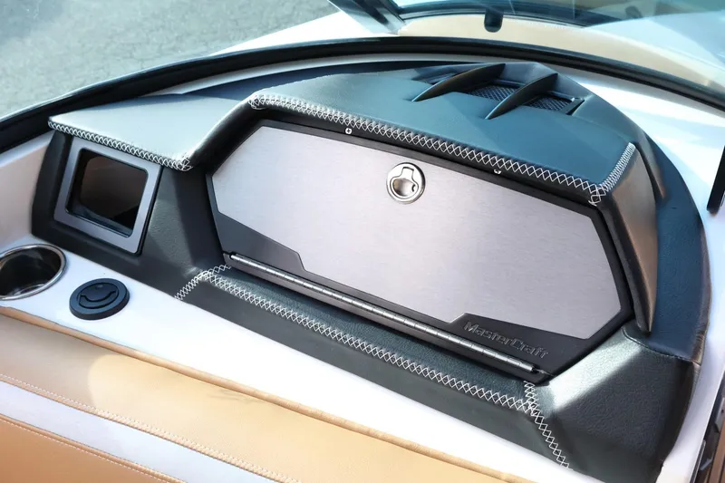 Slide: The Image of 2020 MasterCraft XStar dashboard with sleek design and modern stitching details. - 43