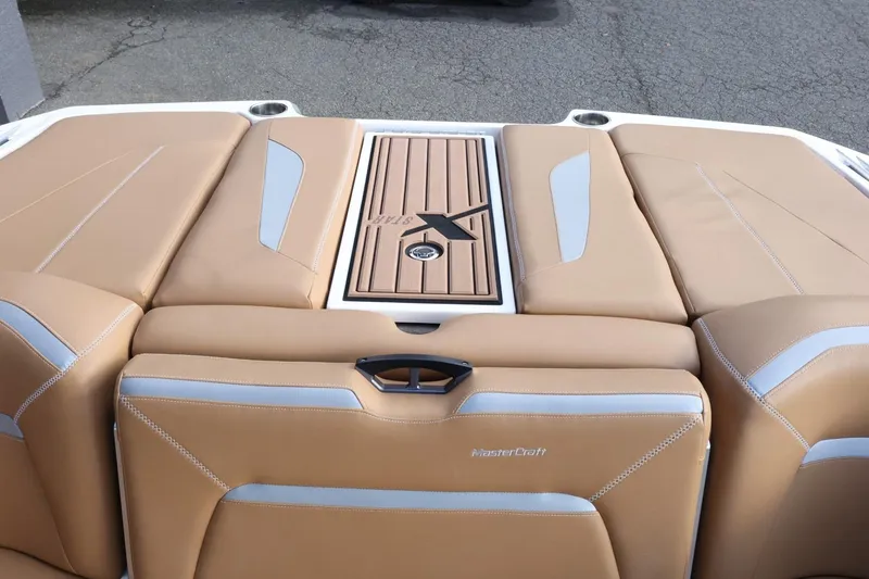 Slide: The Image of 2020 MasterCraft XStar boat with tan upholstery and sleek design. - 52