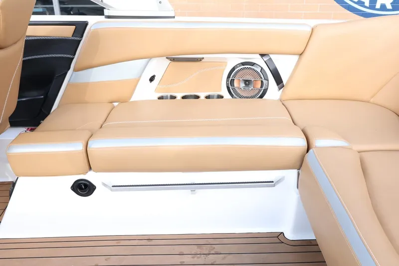 Slide: The Image of 2020 MasterCraft XStar interior with tan leather seating and integrated speaker system. - 58