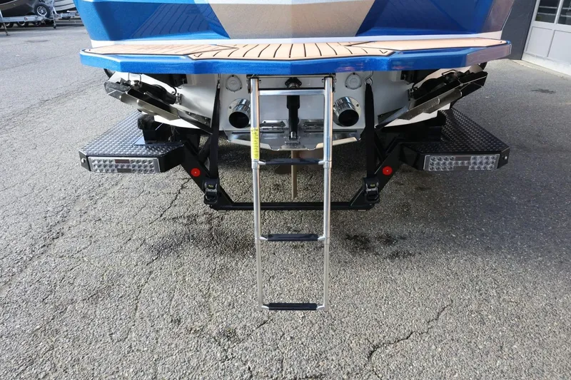 Slide: The Image of 2020 MasterCraft XStar boat rear view with swim platform and ladder. - 9