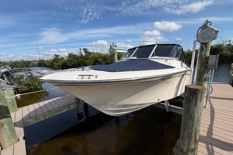 Slide: The Image of 2011 Grady-White Freedom 255 boat docked under clear blue sky. - 18
