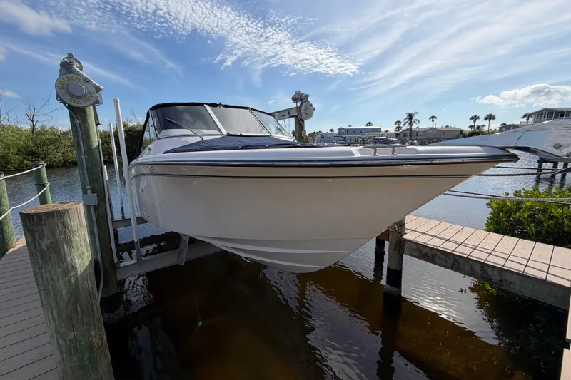 Slide: The Image of 2011 Grady-White Freedom 255 boat docked on a sunny day. - 19