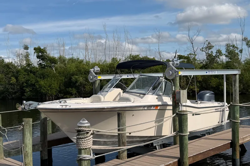 Slide: The Image of 2011 Grady-White Freedom 255 boat docked on a sunny day. - 2