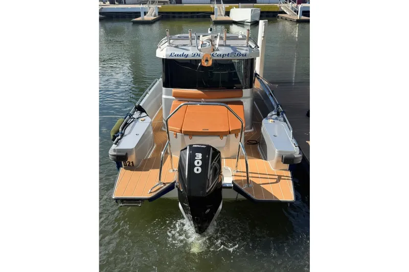 Slide: The Image of 2019 Axopar 28 Cabin boat with 300 HP engine docked at marina. - 10