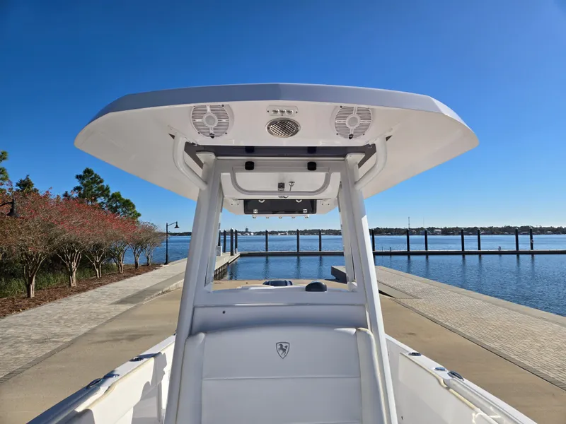 Slide: The Image of 2024 Century 2400CC boat at dock with blue sky. - 10