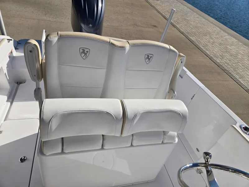 Slide: The Image of 2024 Century 2400CC boat seats at the dock. - 11