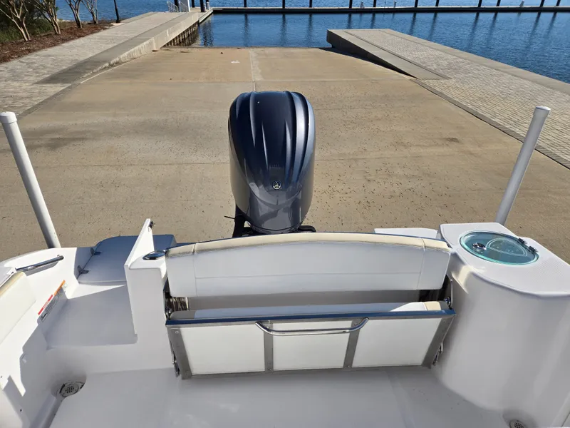 Slide: The Image of Rear view of a 2024 Century 2400CC boat at dock. - 12