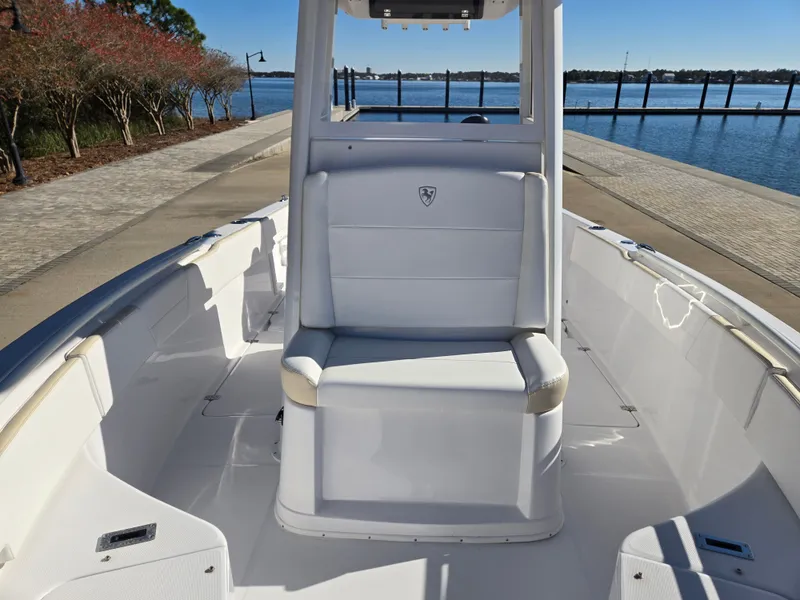 Slide: The Image of 2024 Century 2400CC boat by the water with seating area. - 9