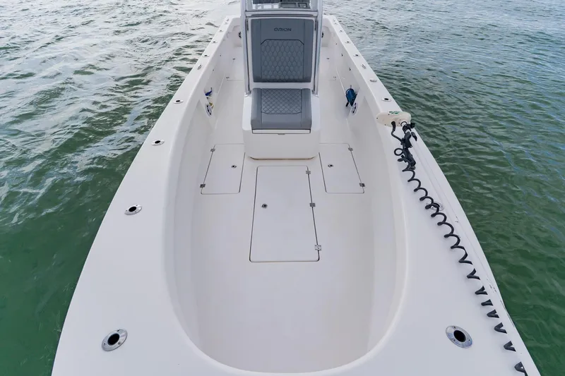 Slide: The Image of 2024 Orion 29CC boat deck, spacious layout, on calm water. - 19