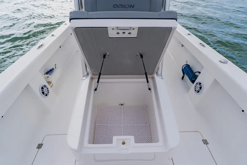 Slide: The Image of 2024 Orion 29CC boat storage compartment open, showcasing spacious interior design. - 20