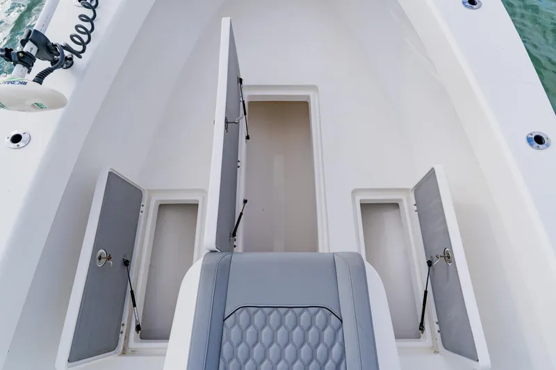 Slide: The Image of 2024 Orion 29CC boat interior with open storage compartments and seating. - 23