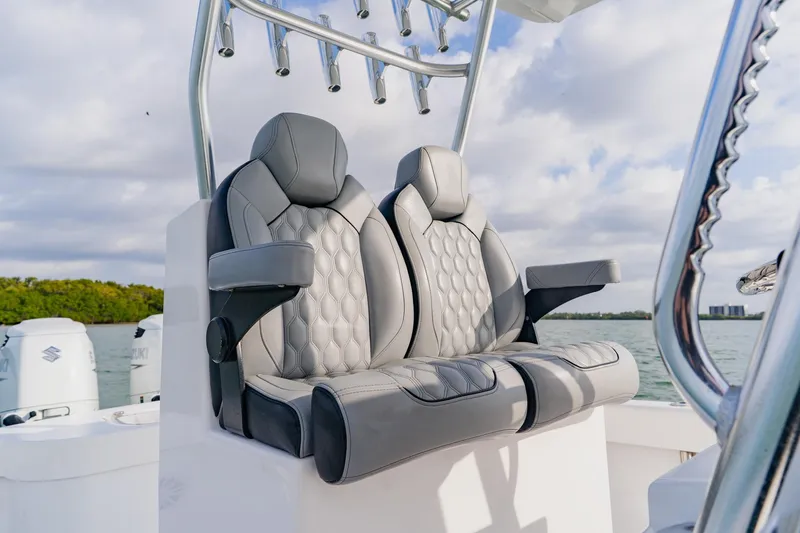 Slide: The Image of Luxurious seating on 2024 Orion 29CC boat with scenic water backdrop. - 37