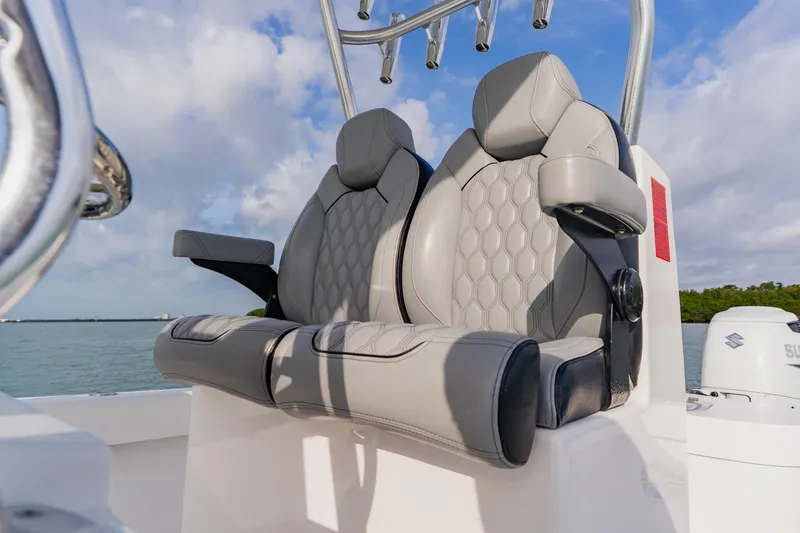 Slide: The Image of Luxury seating on 2024 Orion 29CC boat, featuring stylish gray upholstery and armrests. - 38