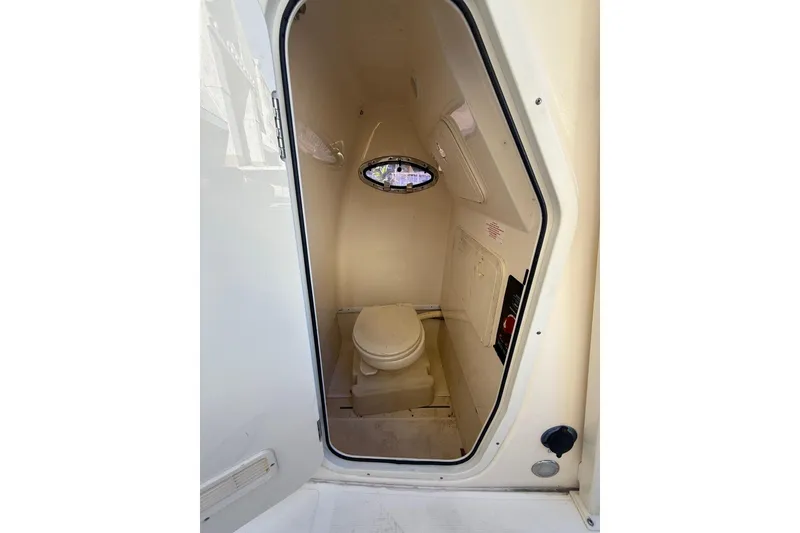 Slide: The Image of 2018 Scout 225 XSF boat interior with compact marine toilet. - 21