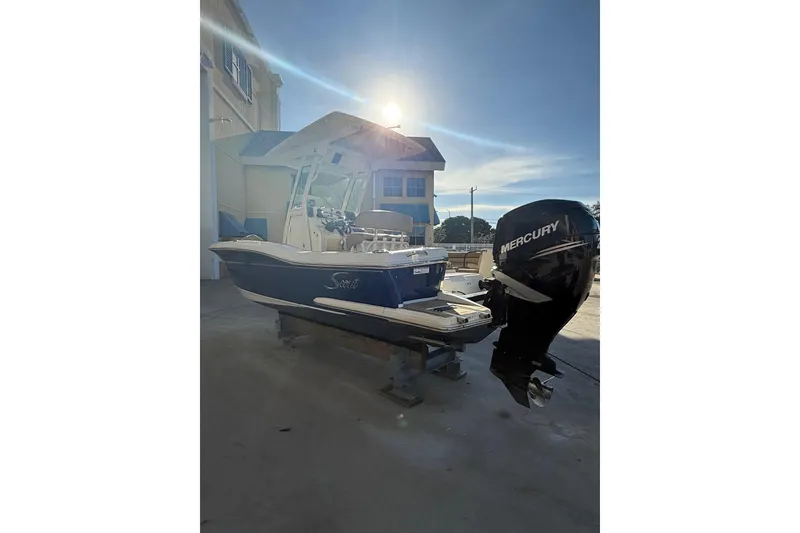 Slide: The Image of 2018 Scout 225 XSF boat with Mercury engine in sunlight. - 3