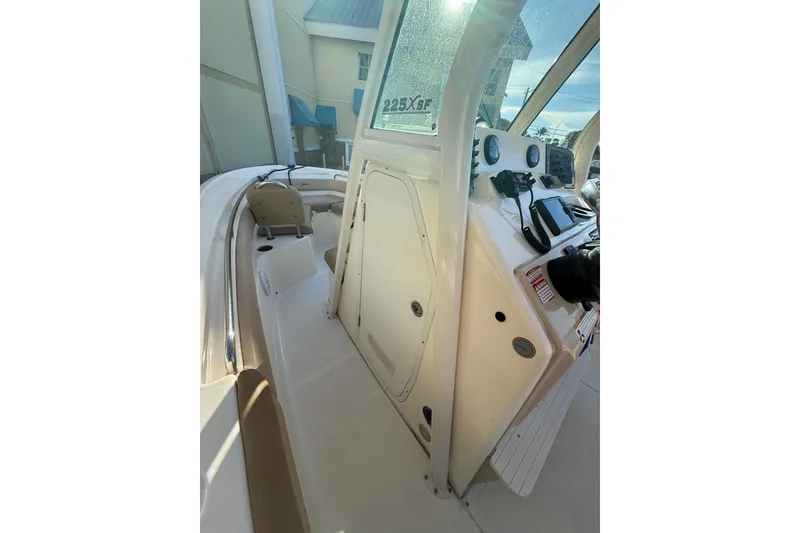 Slide: The Image of 2018 Scout 225 XSF boat interior with console and seating area. - 6