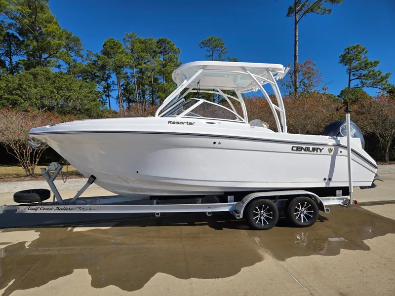 The Image of 2024 Century 24 DC boat on trailer, parked outdoors. - 0