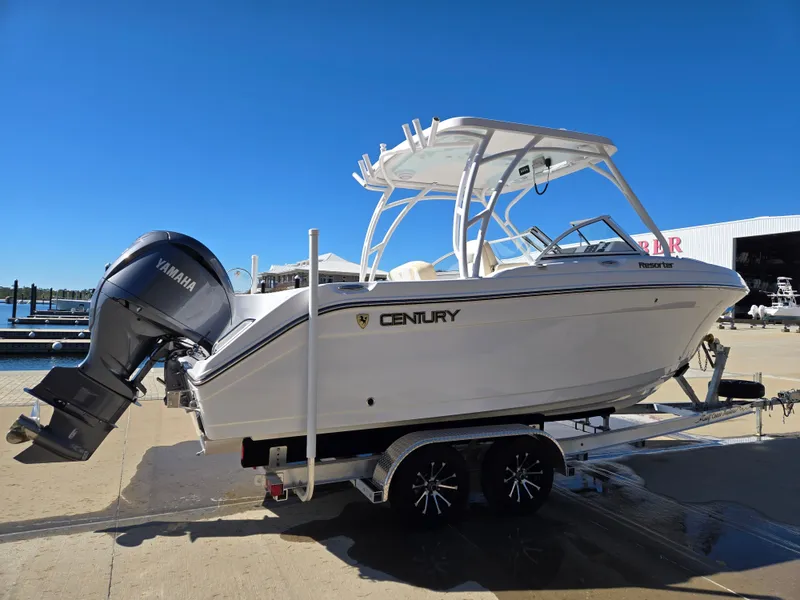 Slide: The Image of 2024 Century 24 DC boat on trailer with Yamaha engine. - 2