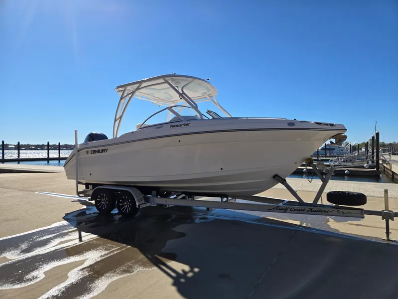 Slide: The Image of 2024 Century 24 DC boat on trailer at dock. - 3