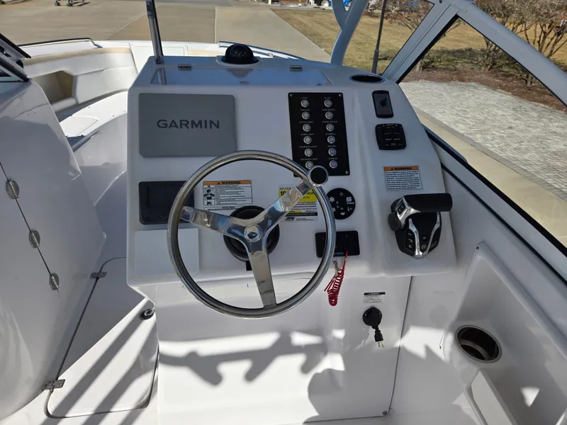 Slide: The Image of Century 24 DC 2024 helm with Garmin navigation system. - 8