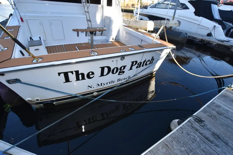 Slide: The Image of 1990 Ocean Yachts 48 Super Sport named "The Dog Patch" docked at marina. - 10