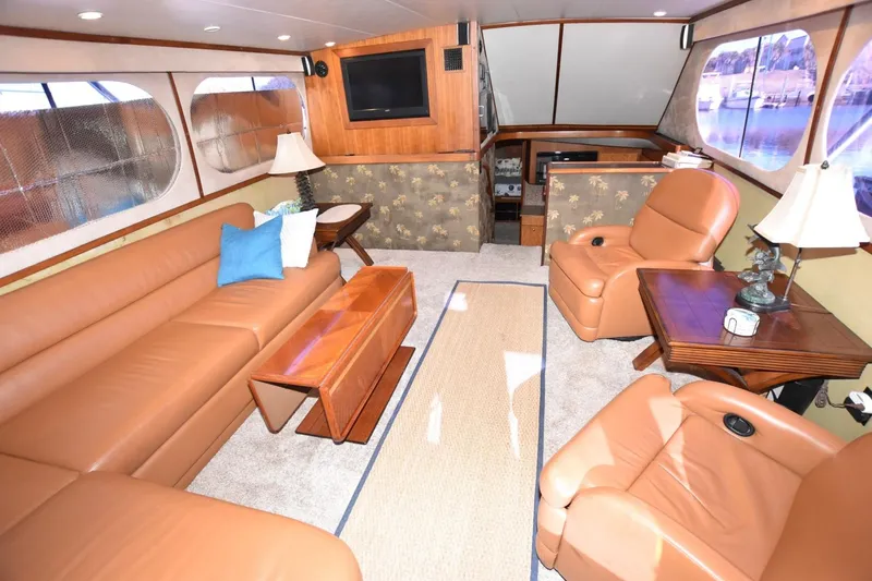 Slide: The Image of Luxurious interior of 1990 Ocean Yachts 48 Super Sport with leather seating and elegant decor. - 11