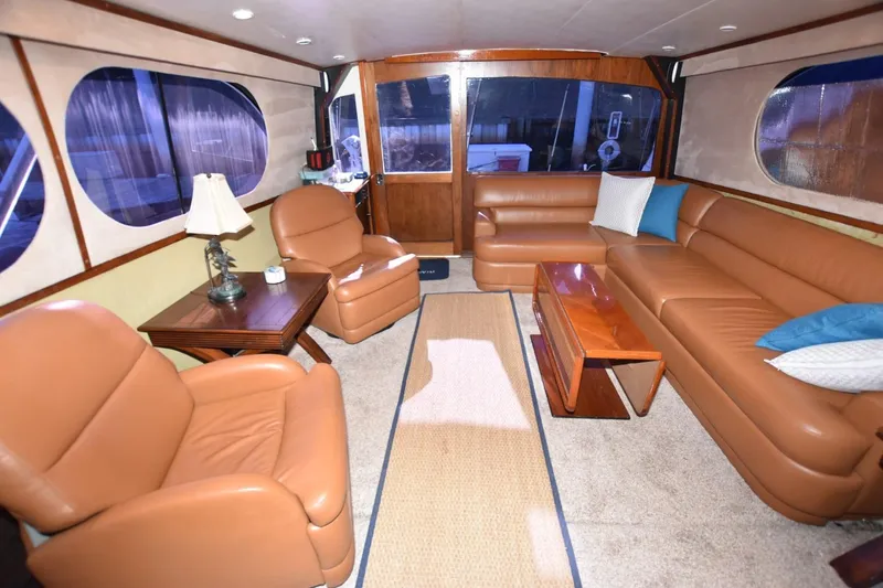 Slide: The Image of Luxurious interior of a 1990 Ocean Yachts 48 Super Sport with leather seating and elegant decor. - 12