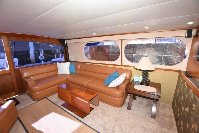Slide: The Image of Luxurious interior of 1990 Ocean Yachts 48 Super Sport with leather seating and elegant decor. - 13