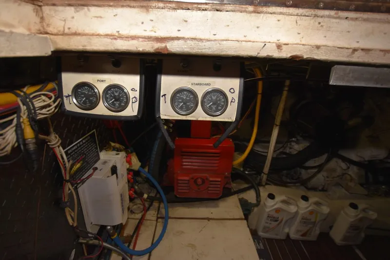 Slide: The Image of Engine room of 1990 Ocean Yachts 48 Super Sport with gauges and wiring. - 26