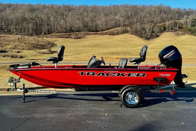 The Image of 2026 Tracker Pro Team 175 Crappie Edition boat on trailer, red with Mercury engine. - 0