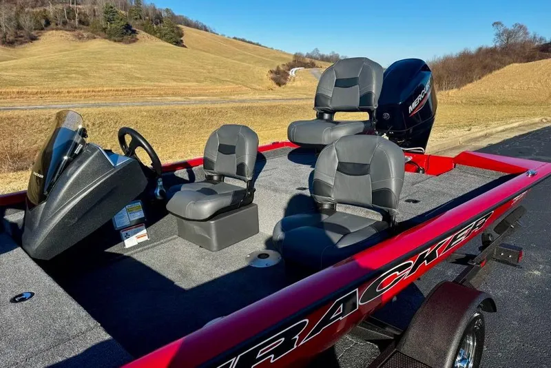 Slide: The Image of 2026 Tracker Pro Team 175 Crappie Edition boat with seating and steering console. - 5