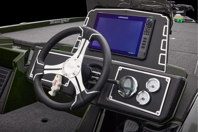 Slide: The Image of 2026 Ranger Z521 boat interior with dual seats, steering wheel, and Garmin displays. - 36