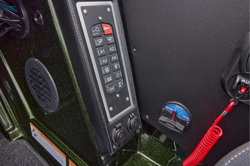 Slide: The Image of 2026 Ranger Z521 boat dashboard with Garmin navigation system and steering wheel. - 42