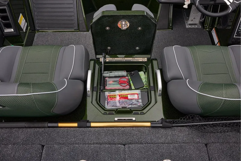 Slide: The Image of 2026 Ranger Z521 boat interior with dual seats and motor, parked on concrete. - 50