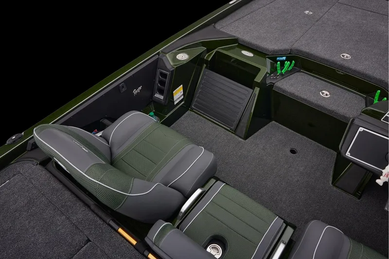Slide: The Image of 2026 Ranger Z521 boat interior with dual seats and motor, docked on concrete. - 51